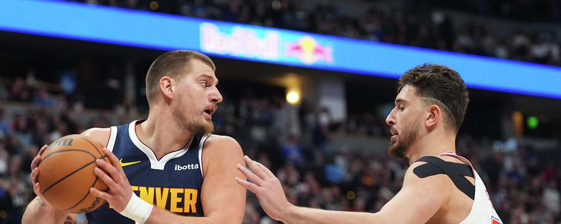 Alperen Sengun guarding Nikola Jokic