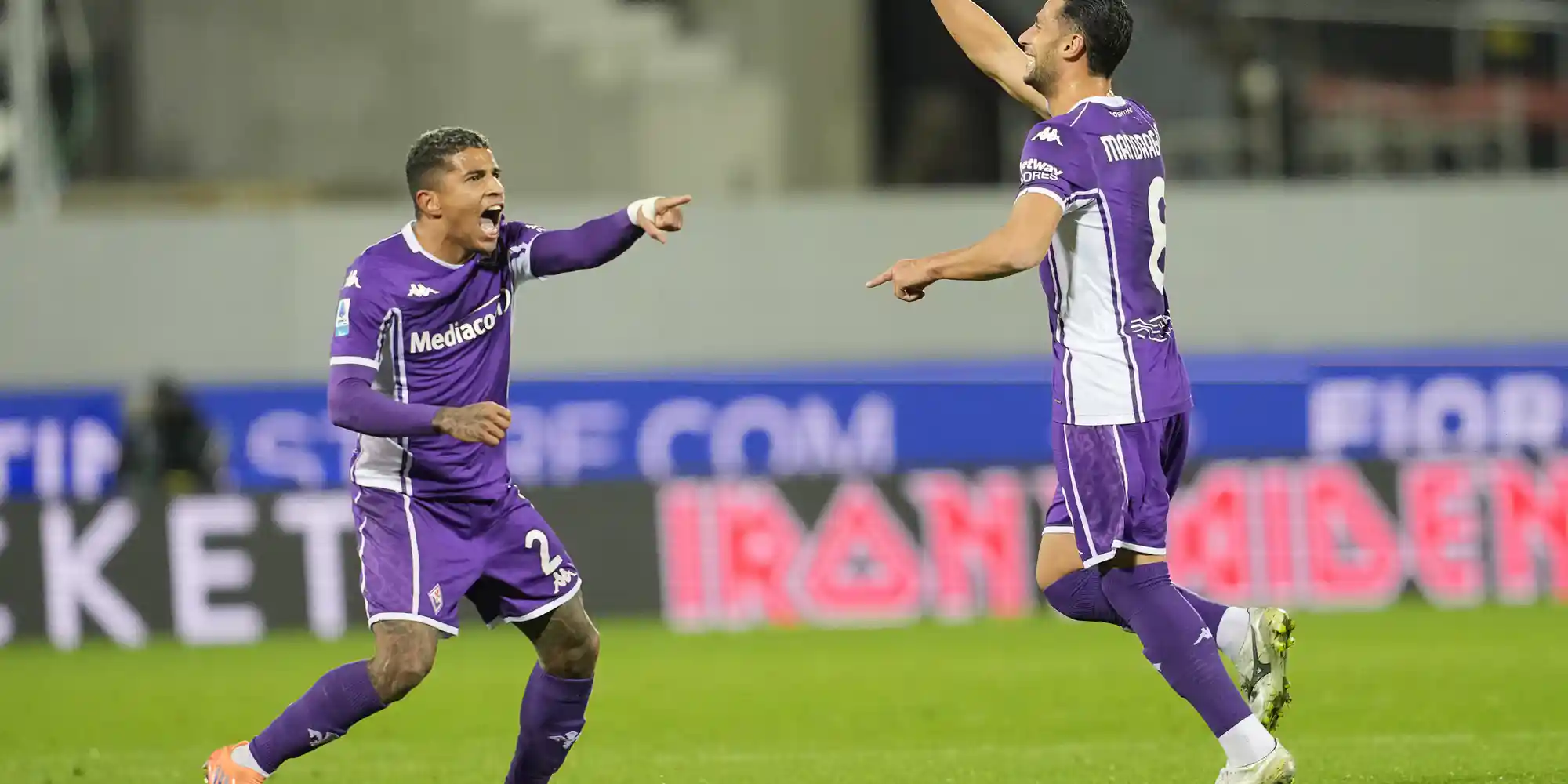 Fiorentina players celebrate after scoring against Udinese
