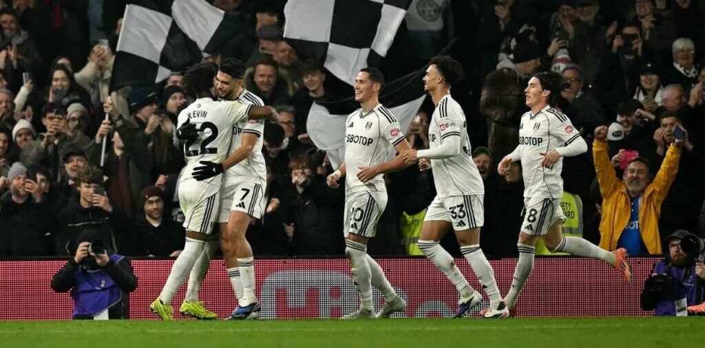 Fulham players celebrate after Raul Gimenez has scored a penalty against Nottingham Forest