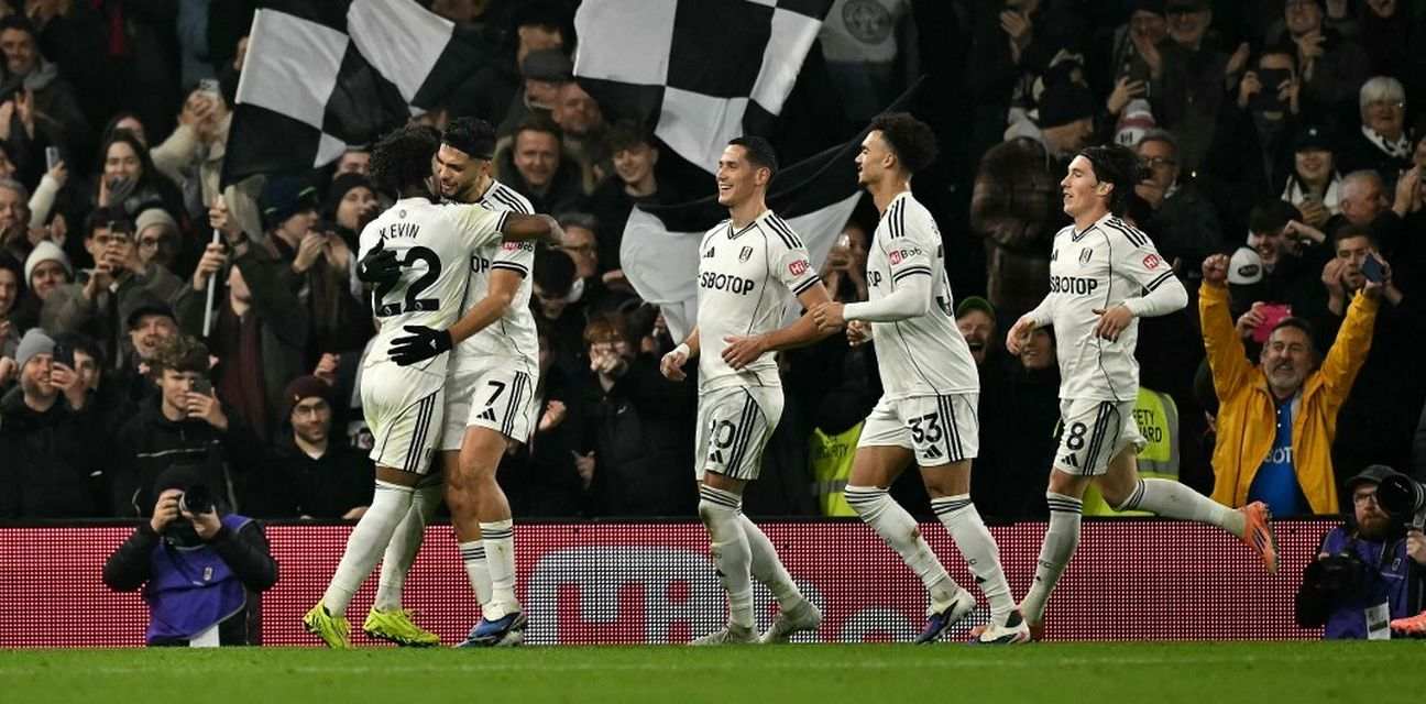 Fulham players celebrate after Raul Gimenez has scored a penalty against Nottingham Forest