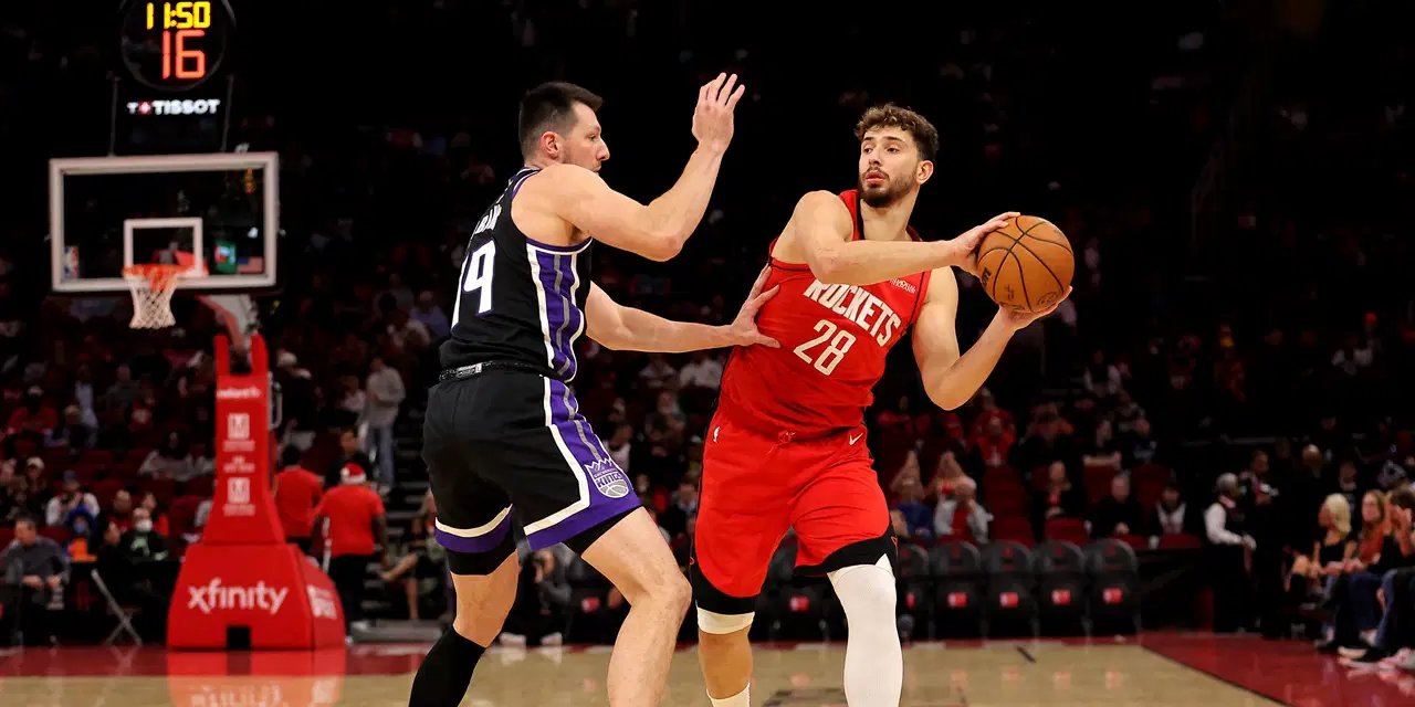 Alperen Sengun guarded by a Sacramento Kings player