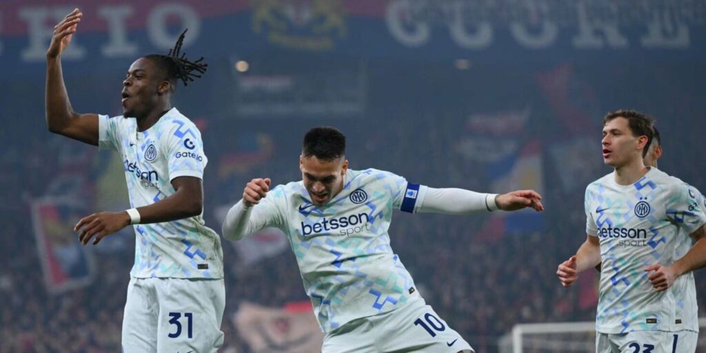 Inter players celebrate after scoring against Genoa