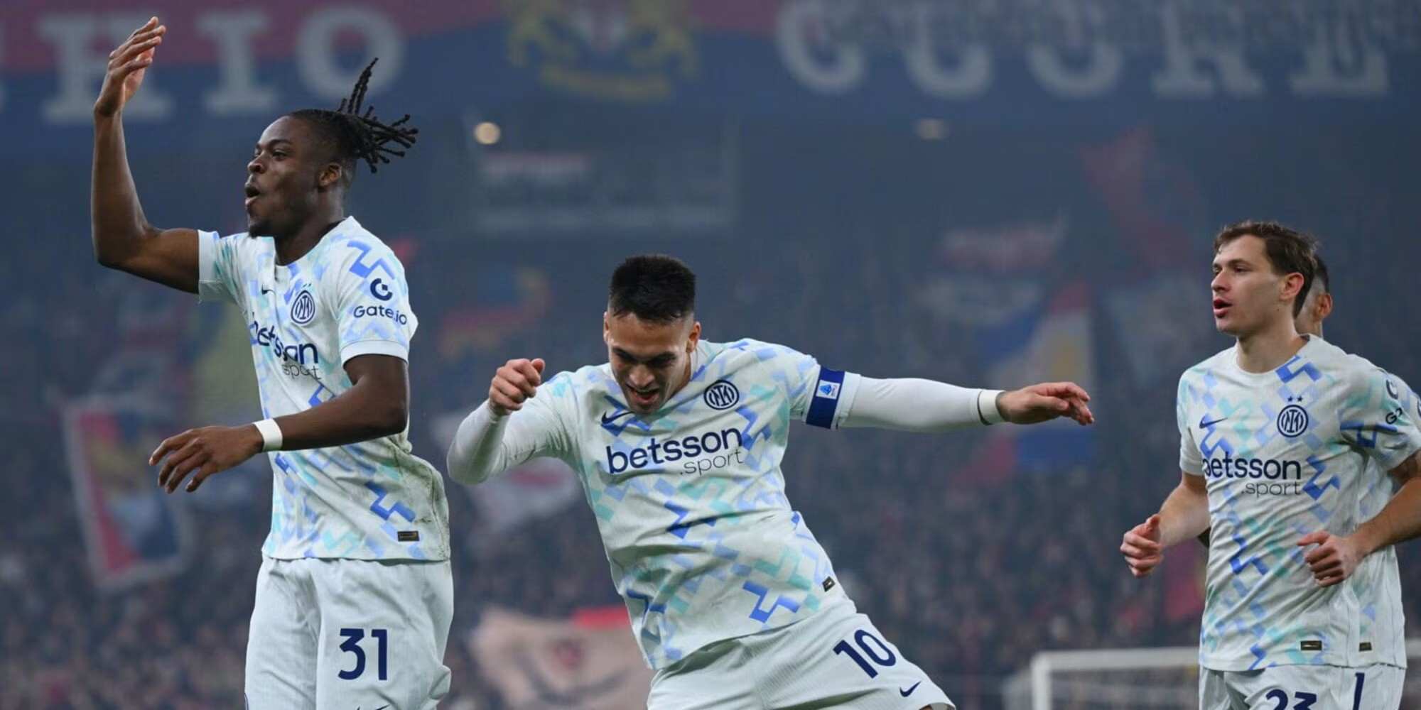 Inter players celebrate after scoring against Genoa