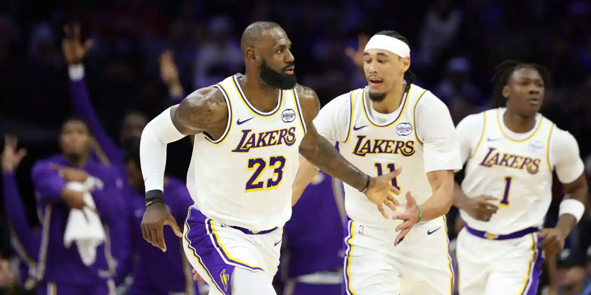 Los Angeles Lakers players congratulate LeBron James