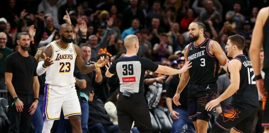 Referee intervenes between LeBron James and Dillon Brooks