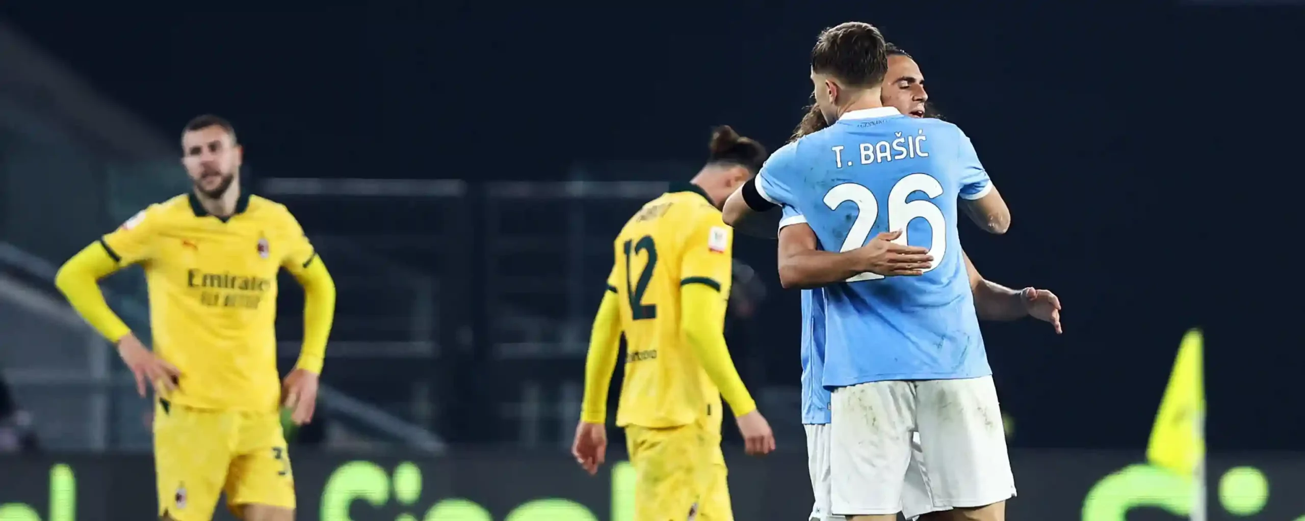 Lazio players hugging each other after winning against Milan