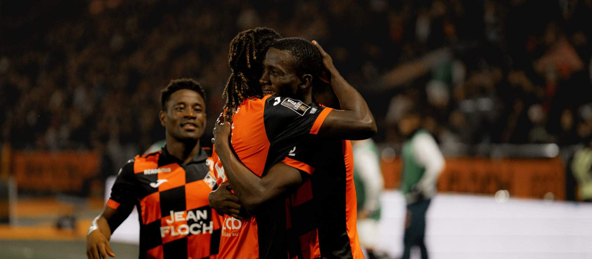 Lorient players celebrate after scoring a goal