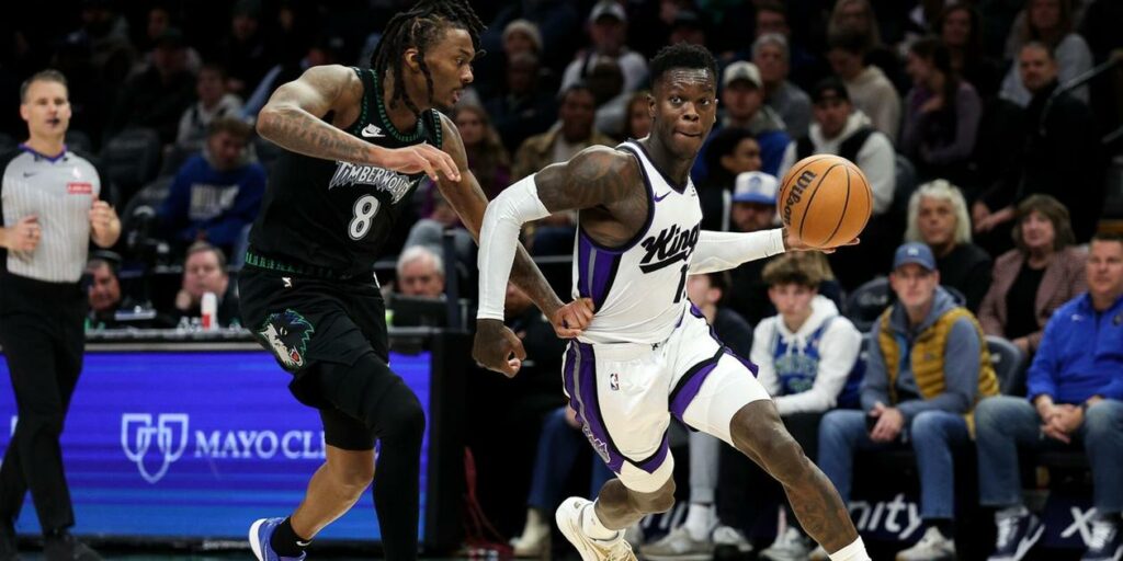 Dennis Schroeder dribbles the ball guarded by Bones Hyland