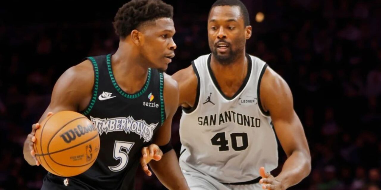 Anthony Edwards (with the ball) guarded by Harrison Barnes