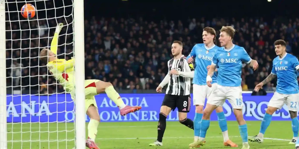 Juventus' goalkeeper parries shot from a Napoli player
