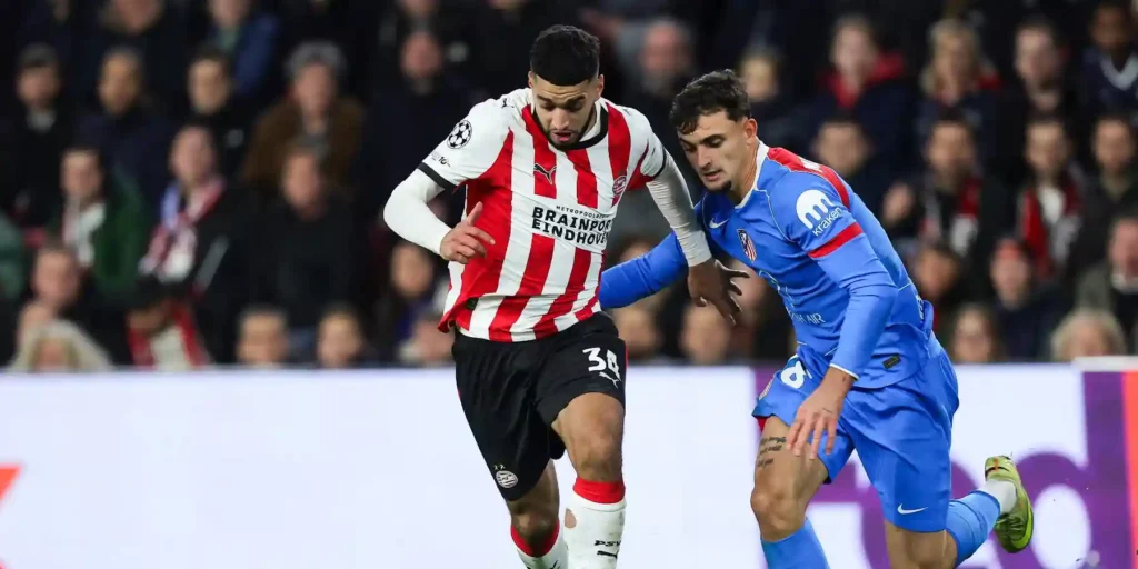 PSV and Atletico Madrid players in a battle for the ball