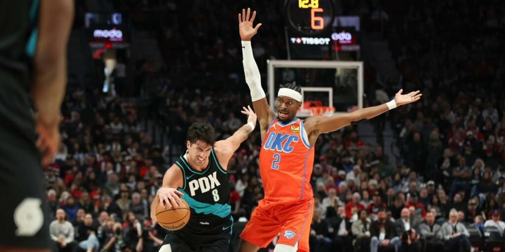 Deni Avdija guarded by Shai Gilgeous-Alexander