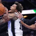 Orlando Magic and San Antonio players battle for the ball