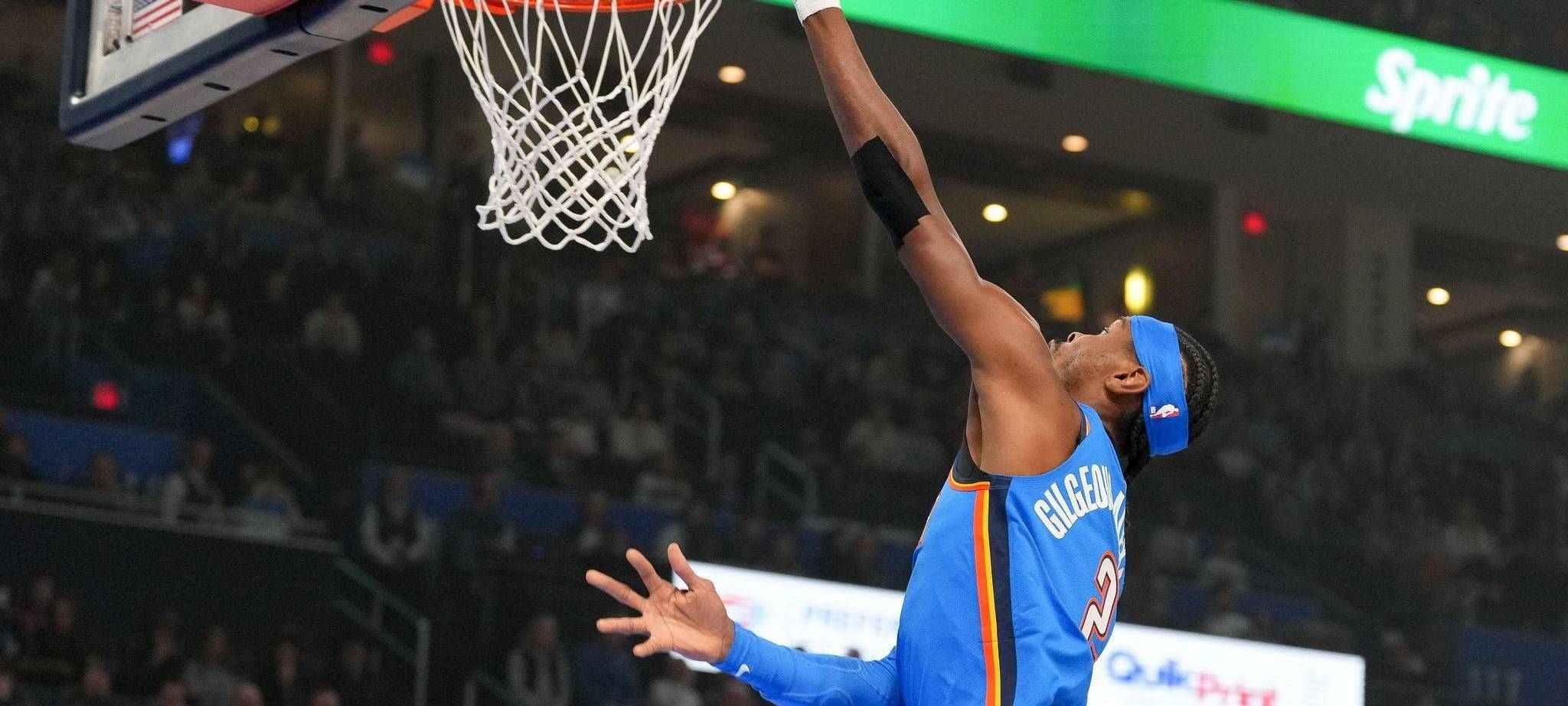 Shai Gilgeous Alexander dunking the ball