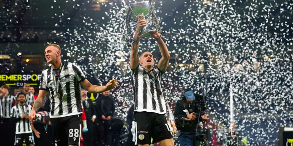 St Mirren players celebrate with the League Cup trophy