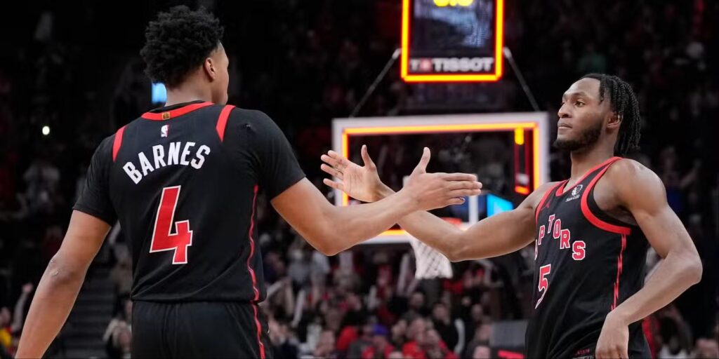 Toronto Raptors players congratulate one another