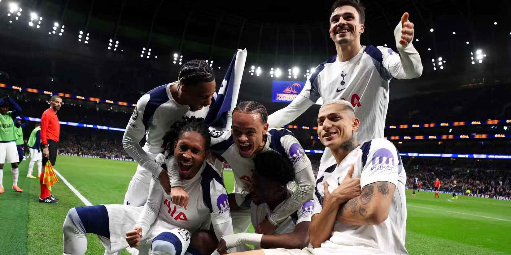 Tottenham players celebrate after scoring against Slavia