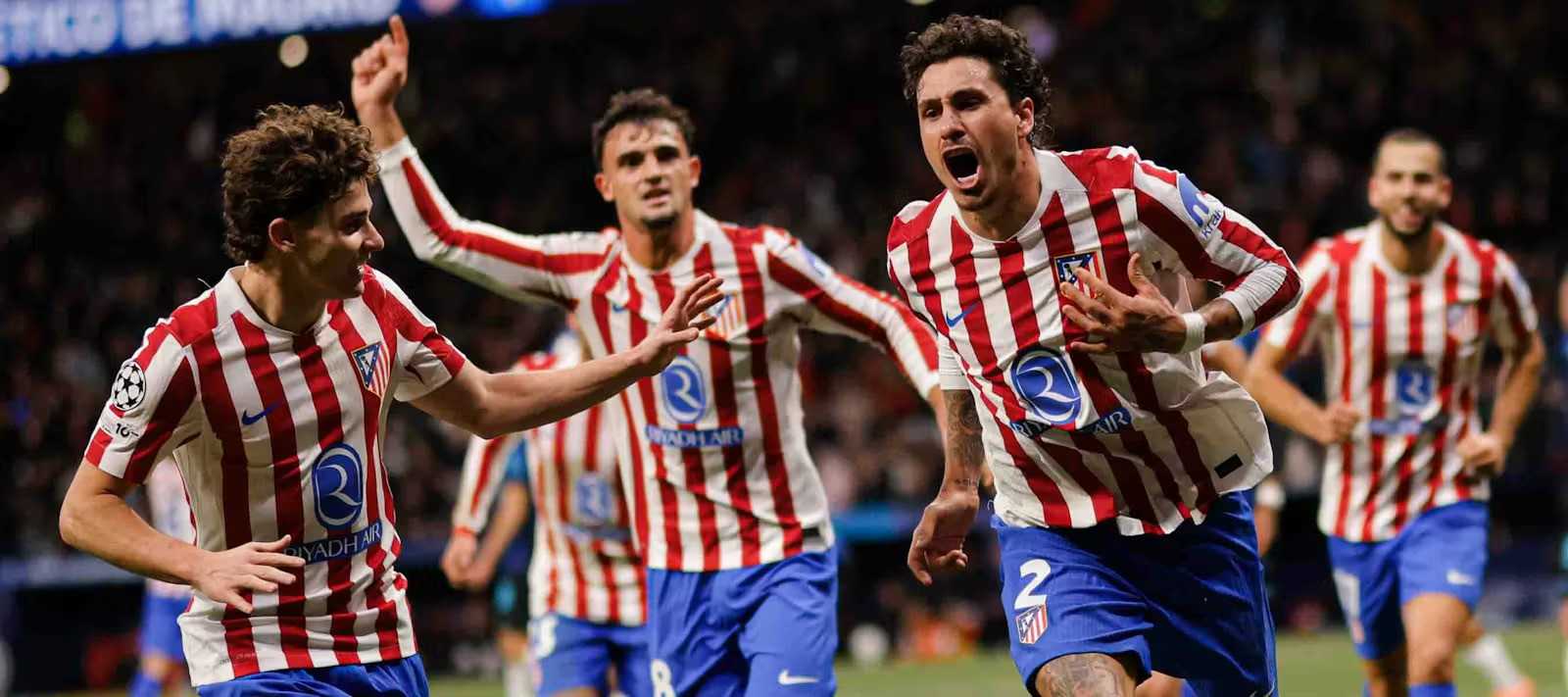 Atletico Madrid players celebrate after scoring a goal