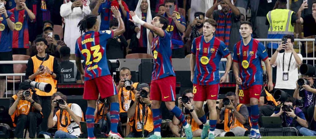 Barcelona players congratulate one another after scoring against Athletic