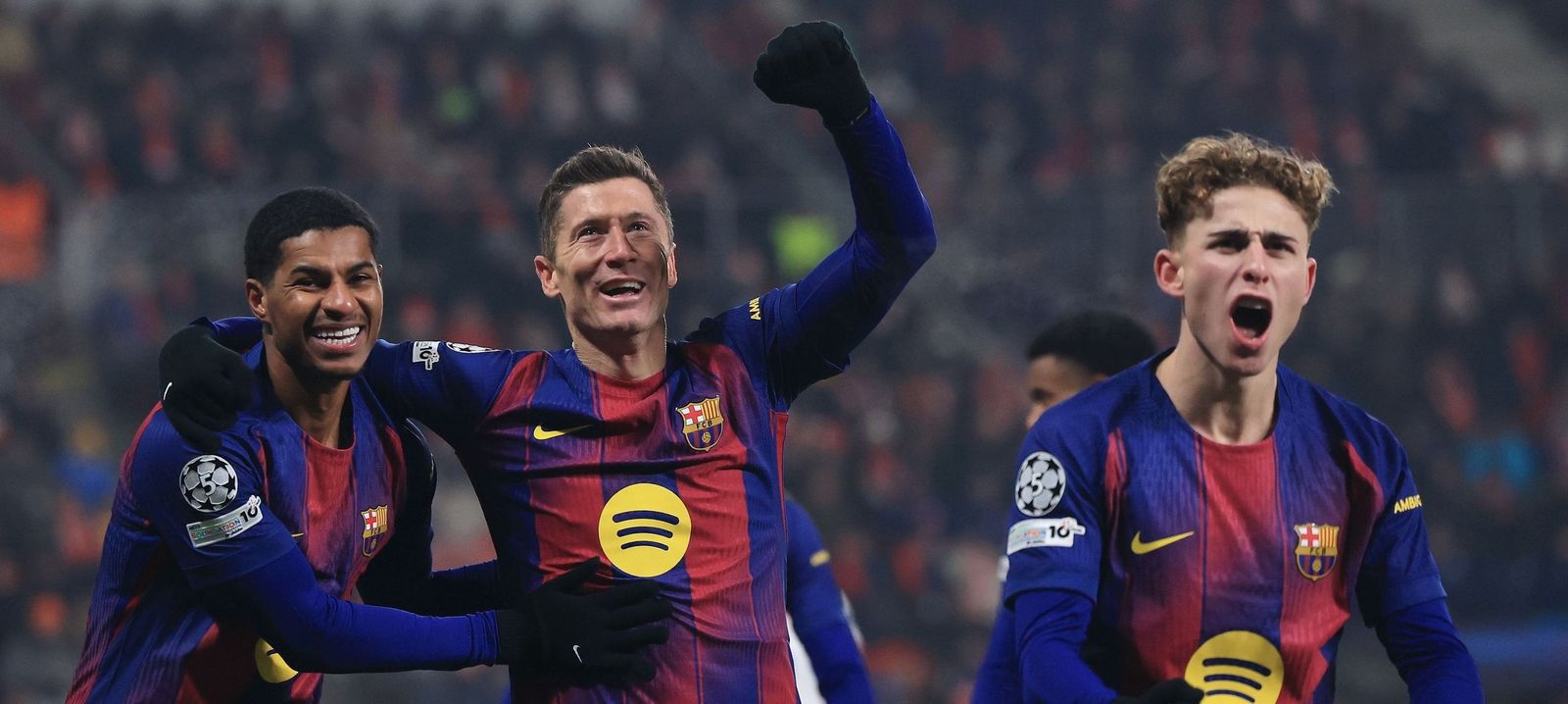 Barcelona players celebrate after scoring against Slavia Prague