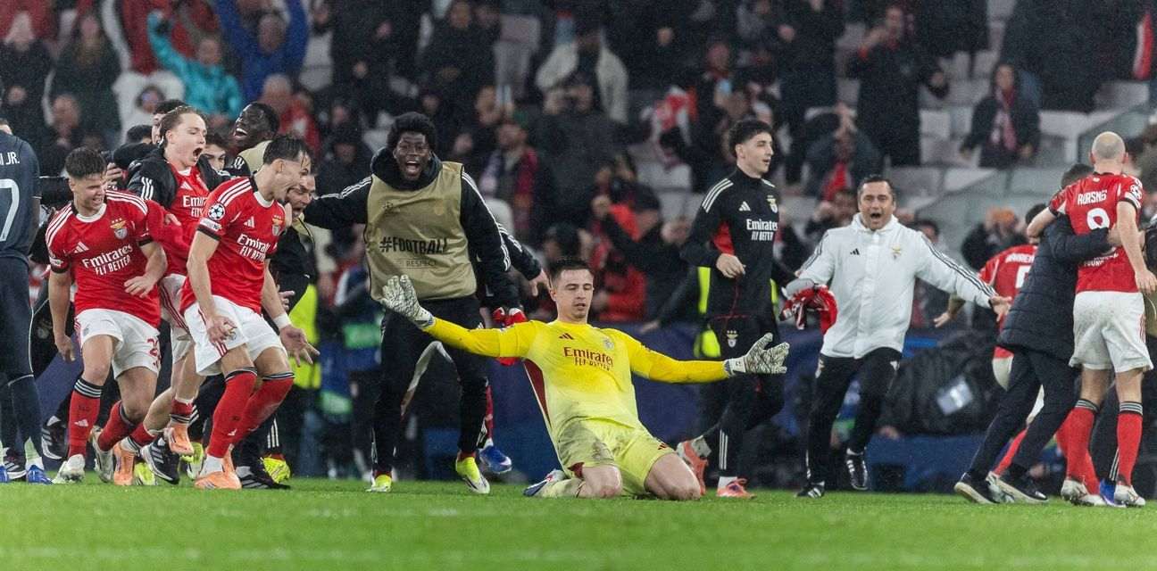 Benfica players celebrate after goalkeeper Trubin scored a stoppage time header against Real Madrid