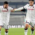 Bologna players celebrate after scoring against Verona