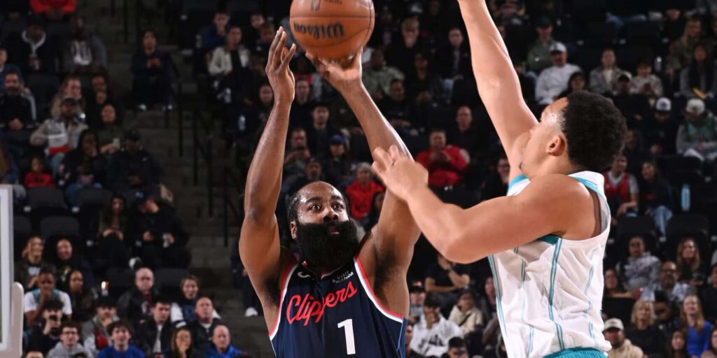 James Harden shooting over a Charlotte Hornets player