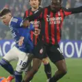 Como player trying to dribble between multiple opponents from Milan