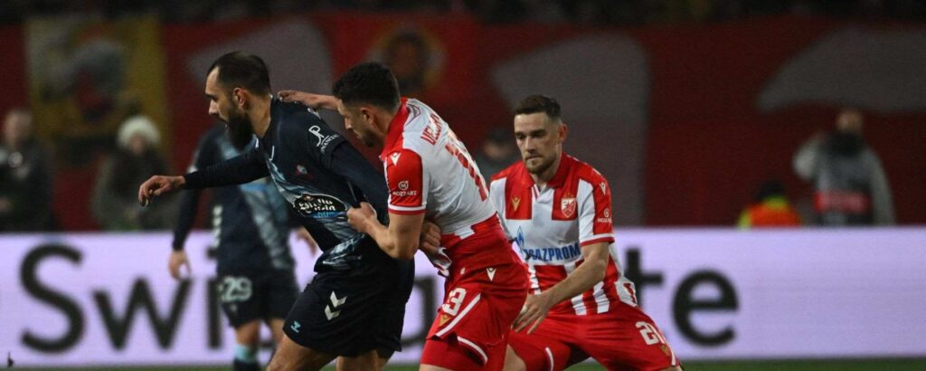 Crvena Zvezda and Celta players battle for the ball