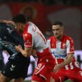 Crvena Zvezda and Celta players battle for the ball