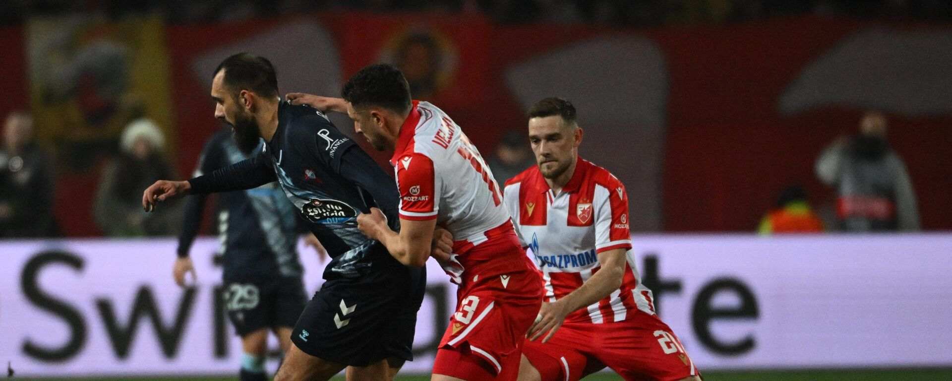 Crvena Zvezda and Celta players battle for the ball