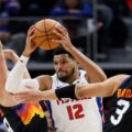Tobias Harris guarded by multiple Phoenix Suns players