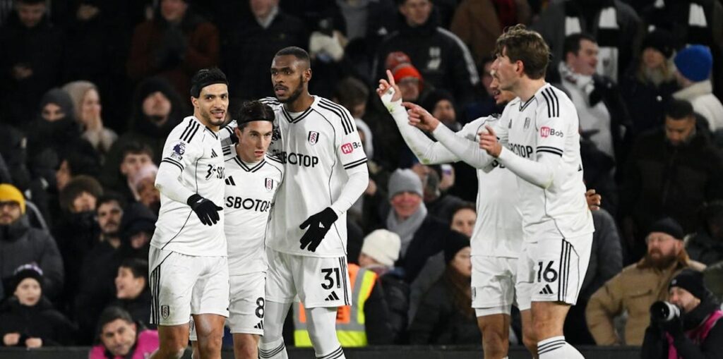Fulham players celebrate after scoring against Chelsea