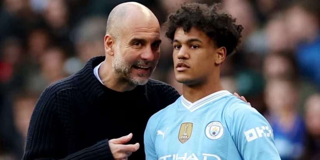 Pep Guardiola and Oscar Bobb