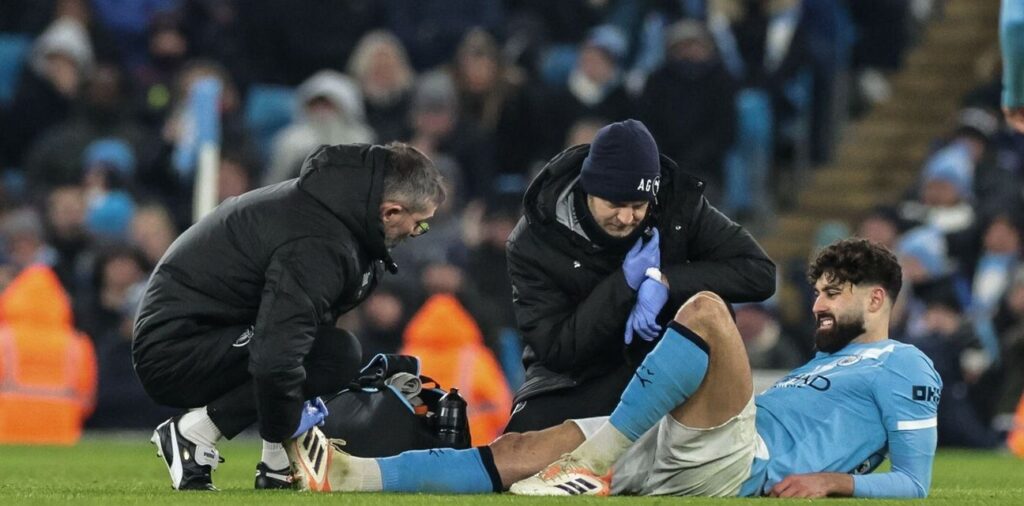 Manchester City defender Josko Gvardiol laying injured