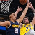 Luka Doncic attacking Denver Nuggets' basket