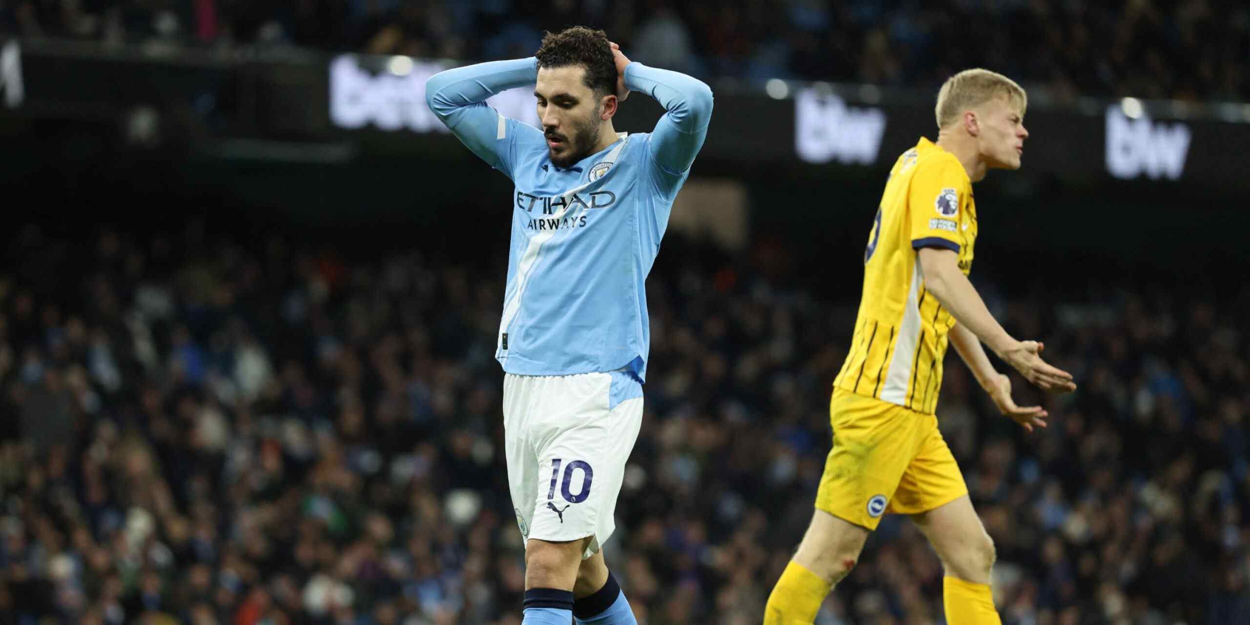 Rayan Cherki holding his head