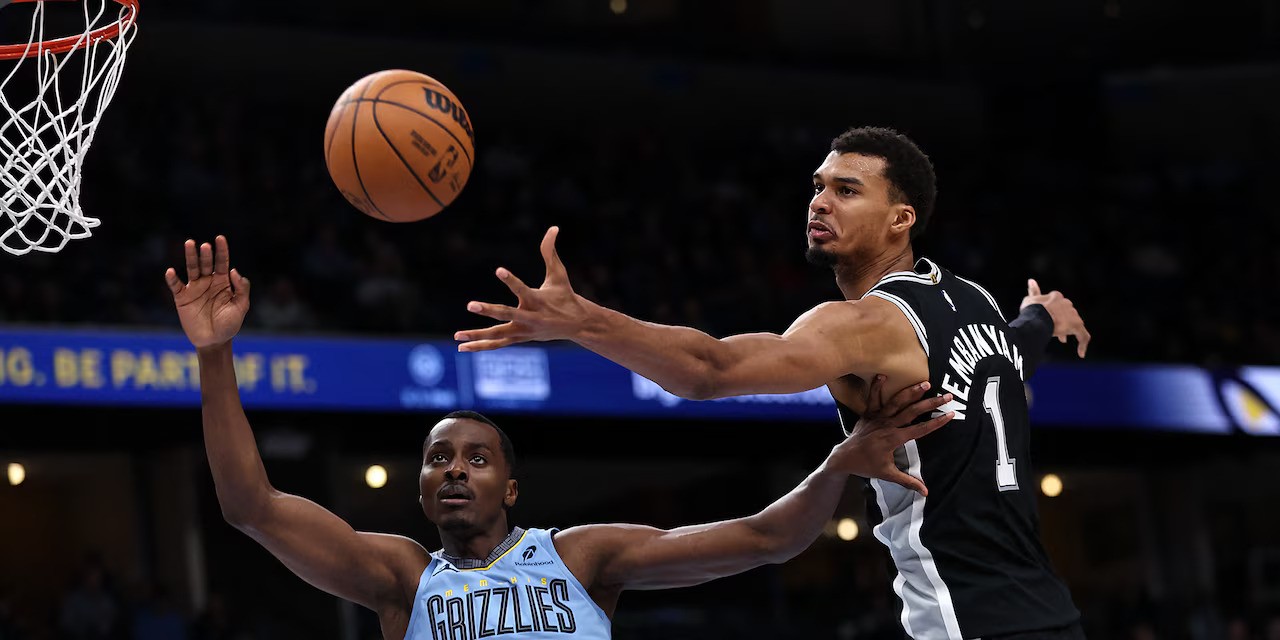 Victor Wembanyama lays the ball in Memphis' basket