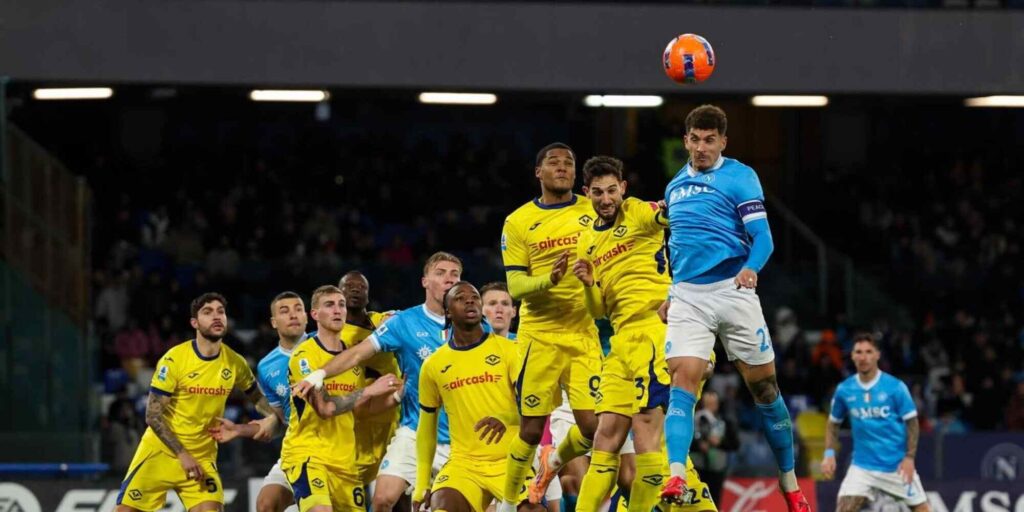Players from Verona and Napoli jumping for a high ball