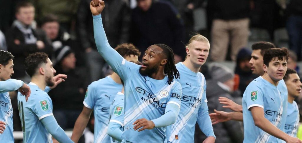 Manchester City players celebrate after scoring against Newcastle