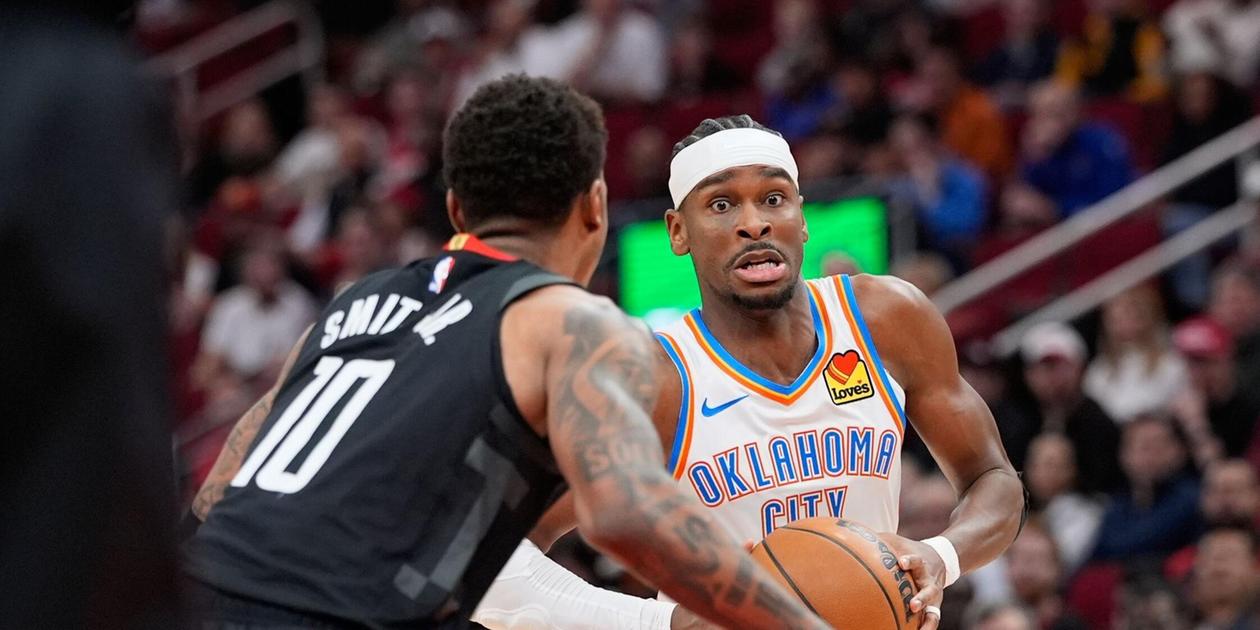 Shai Gilgeous-Alexander guarded by Jabari Smith Jr.
