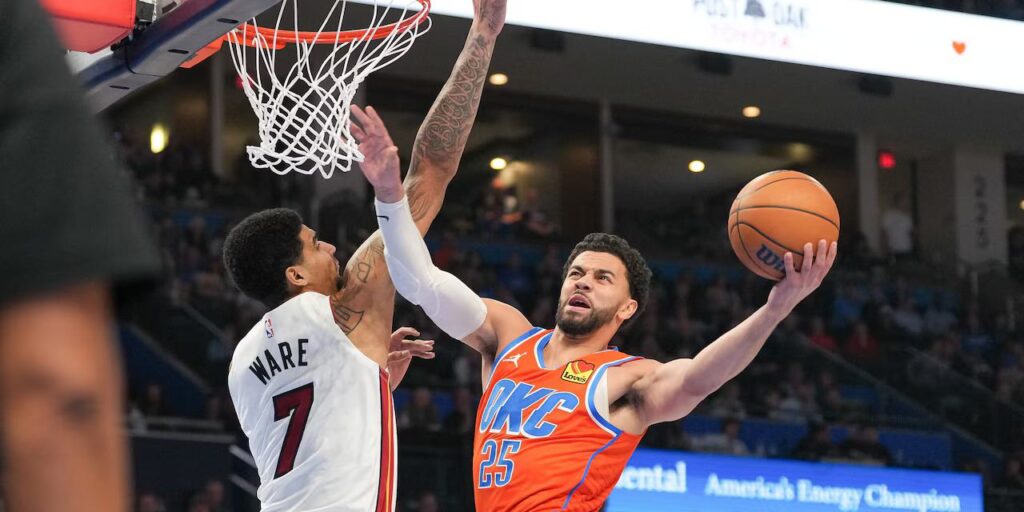 Ajay Mitchell attempts a lay up despite Kel'el Ware's defence