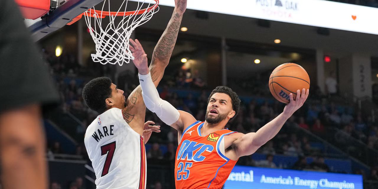 Ajay Mitchell attempts a lay up despite Kel'el Ware's defence