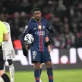 Ousmane Dembele holding the ball during the Paris derby