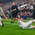 Real Madrid players celebrate after Fede Valverde has scored against Atletico Madrid