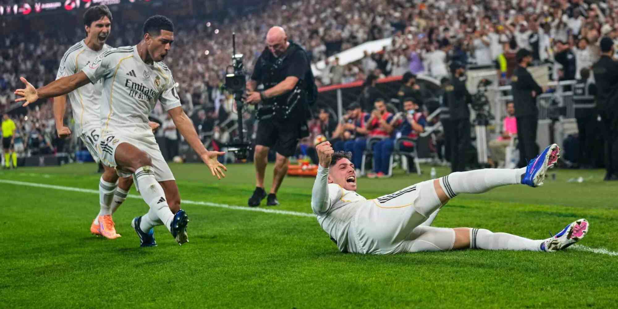 Real Madrid players celebrate after Fede Valverde has scored against Atletico Madrid