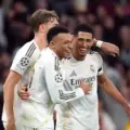 Kylian Mbappe and Jude Bellingham hugging each other after Real Madrid have scored against Monaco