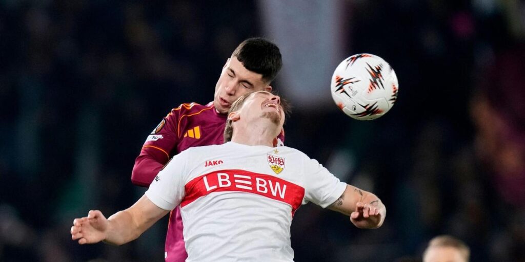 Roma and Stuttgart players in a battle for a high ball