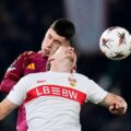 Roma and Stuttgart players in a battle for a high ball