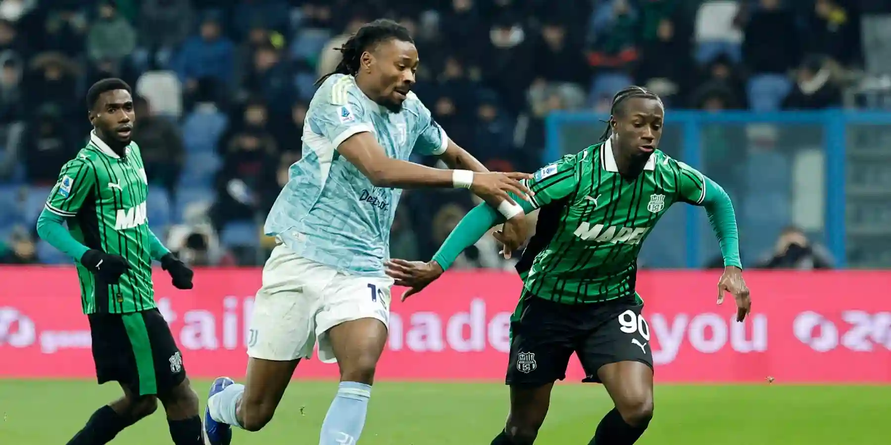 Juventus and Sassuolo players in a battle for the ball